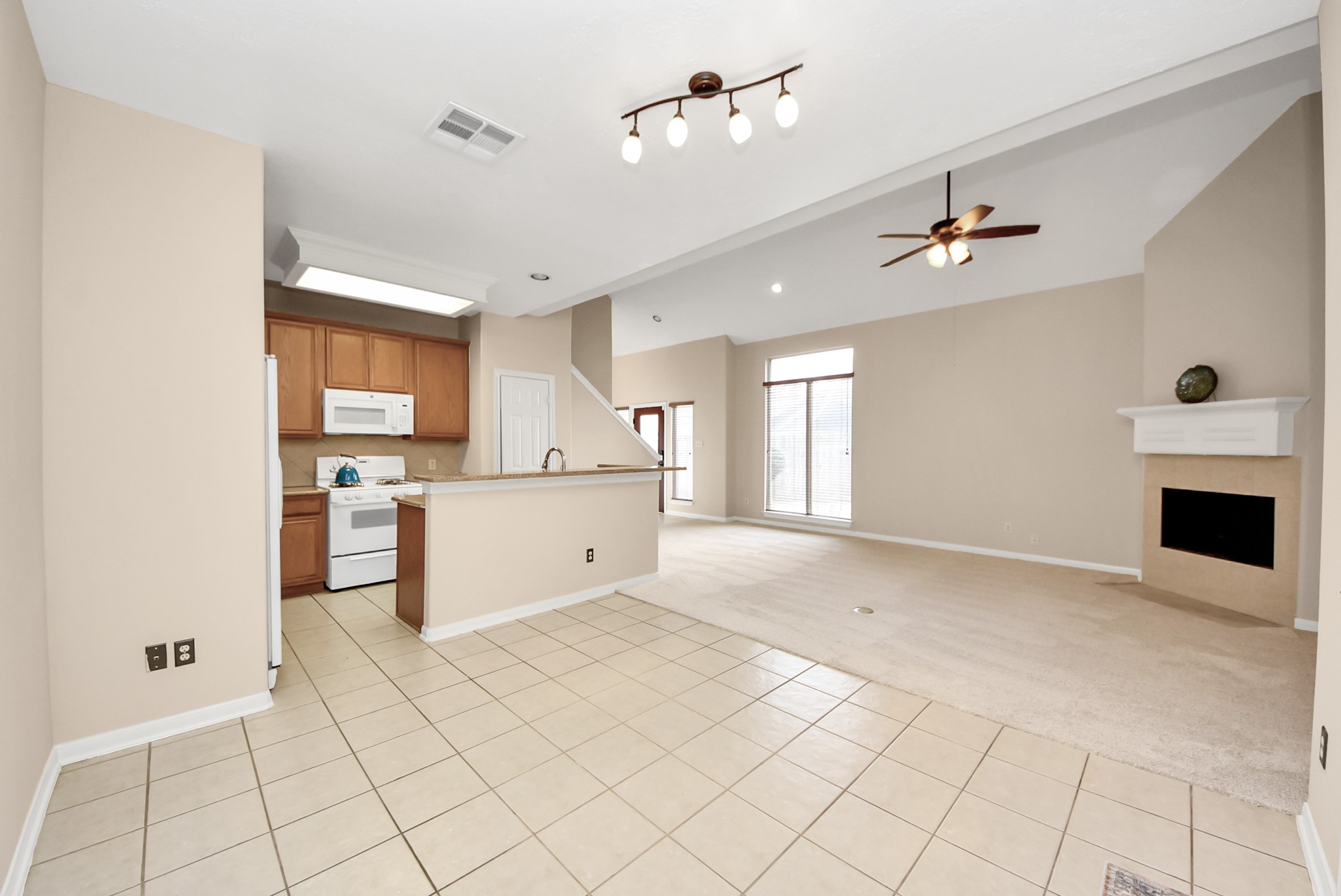 18963 Candlelight Crescent Road Spring, TX 77388 - Photo 13 of 33 The dining area flows seamlessly into the kitchen, creating an open and functional layout.