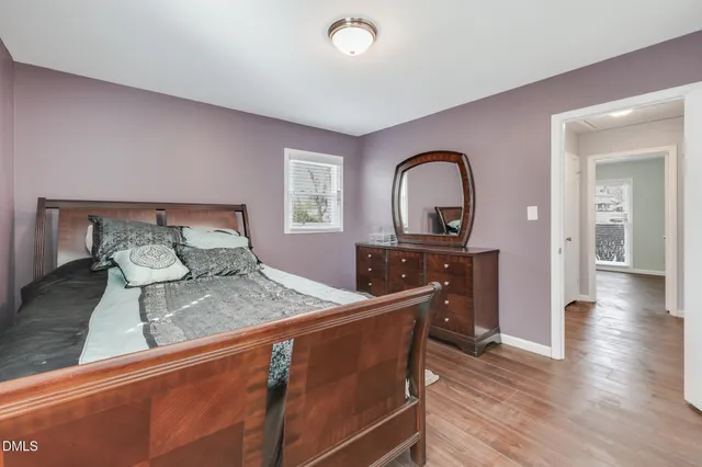 a bedroom with a bed and a dresser