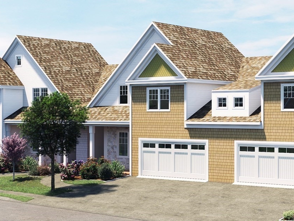 a front view of a house with garage and garage