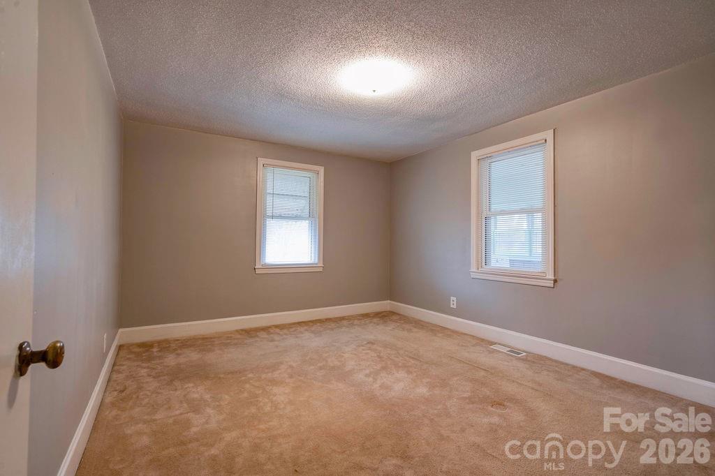 714 Linwood Road Kings Mountain, NC 28086 - Photo 18 of 26 an empty room with windows