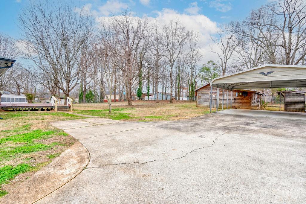 714 Linwood Road Kings Mountain, NC 28086 - Photo 22 of 26 a view of a swimming pool with tree s
