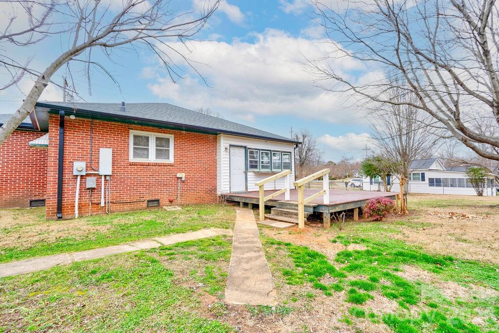714 Linwood Road Kings Mountain, NC 28086 - Photo 23 of 26 a wooden bench sitting in front of a house