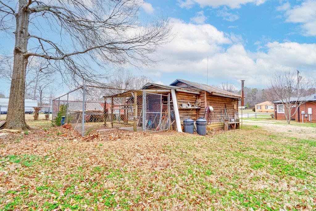 714 Linwood Road Kings Mountain, NC 28086 - Photo 24 of 26 a view of a house with a large tree in front of it