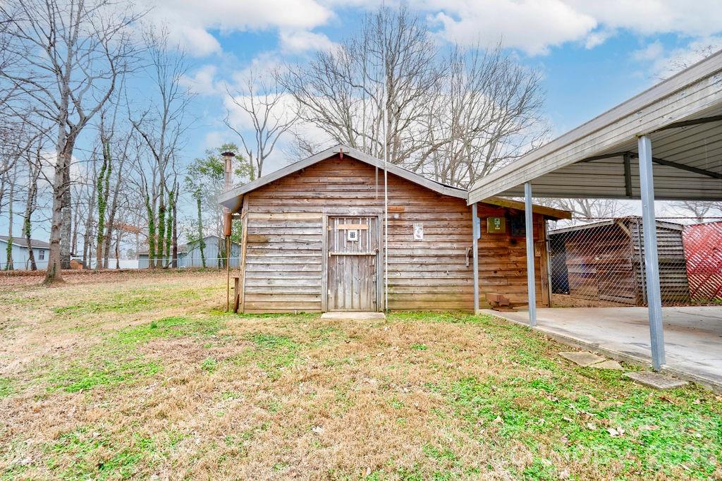 714 Linwood Road Kings Mountain, NC 28086 - Photo 25 of 26 a view of a house with a yard and garage