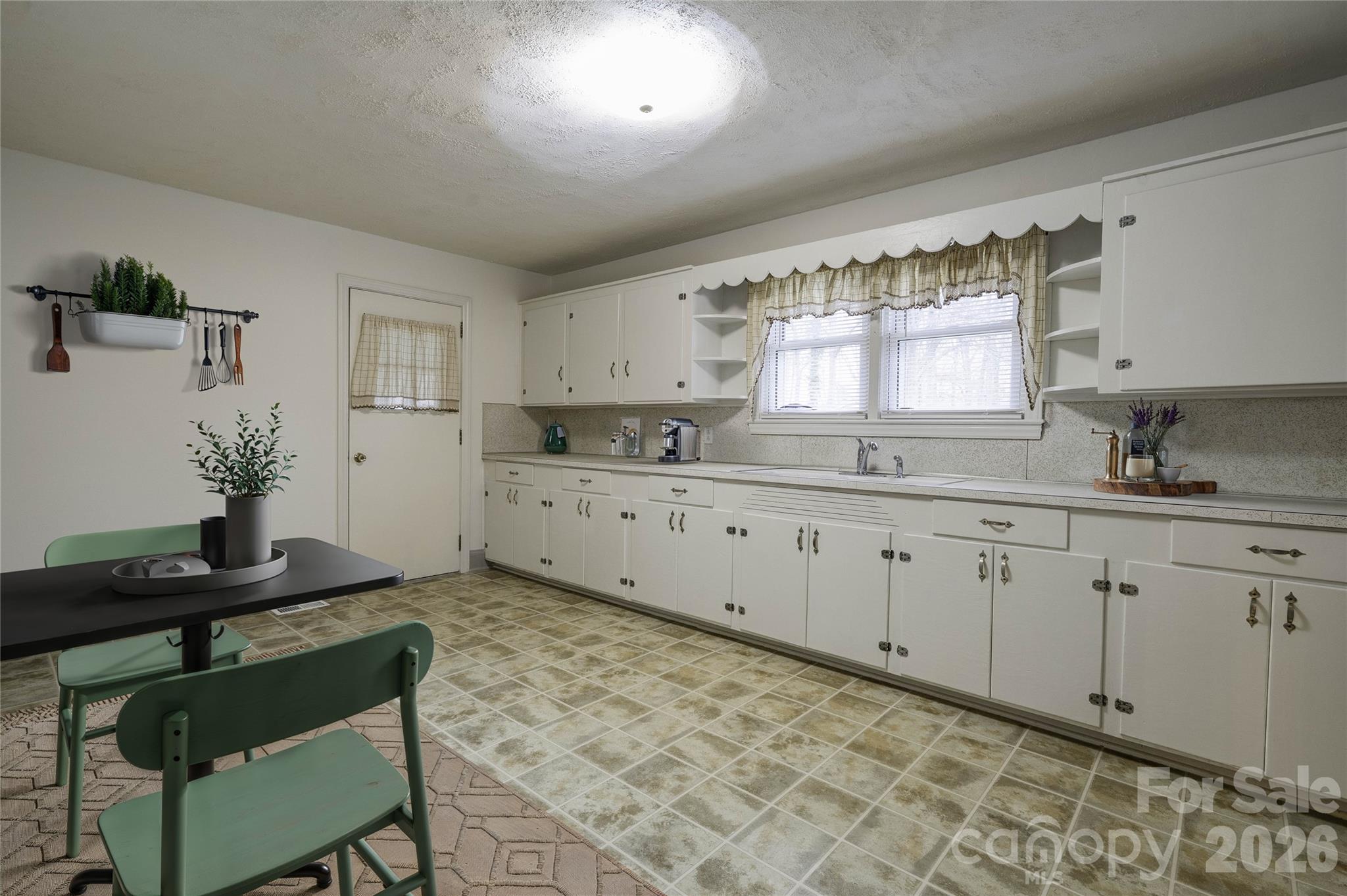 714 Linwood Road Kings Mountain, NC 28086 - Photo 5 of 26 a kitchen with granite countertop a sink cabinets and window