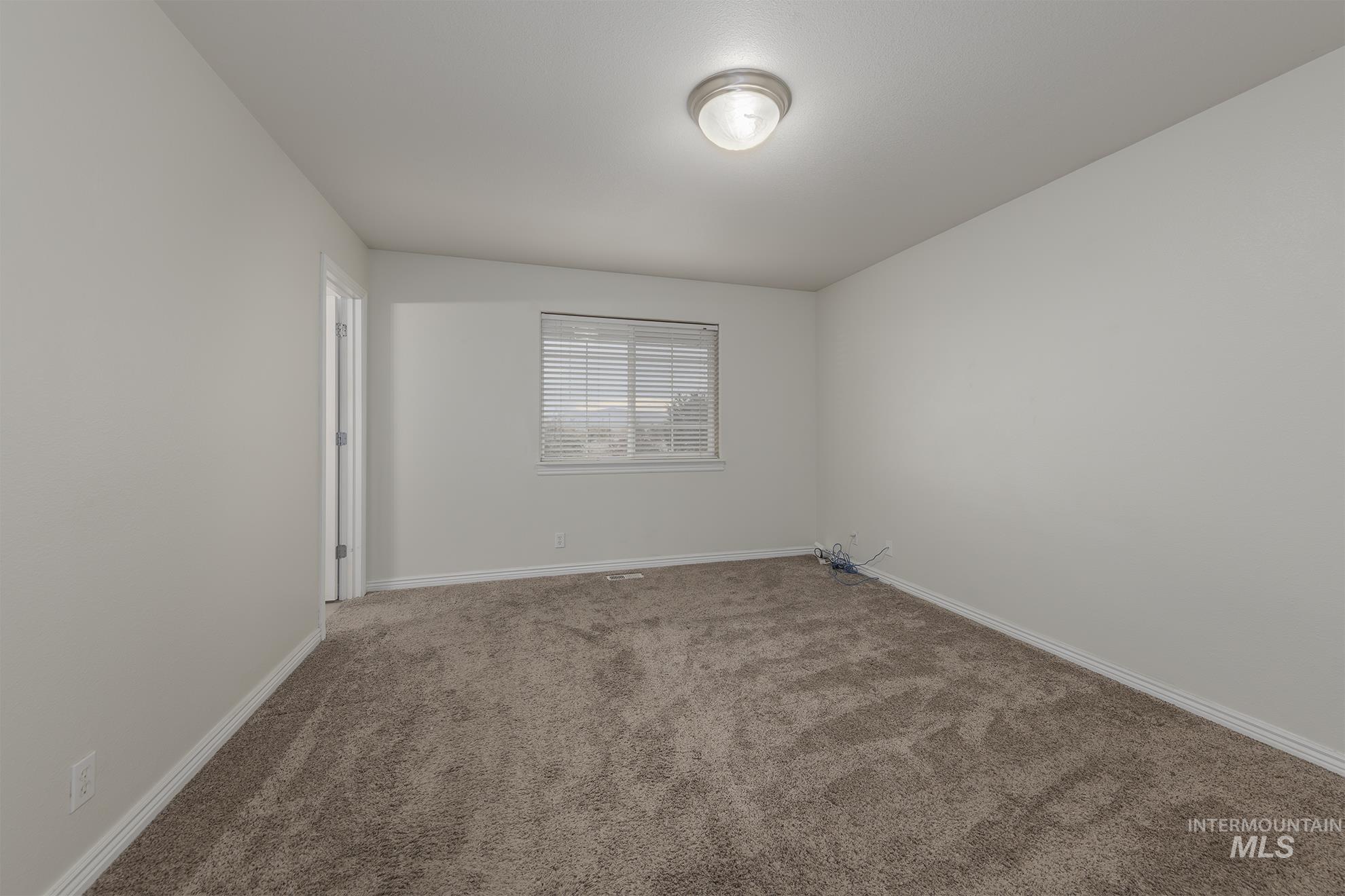 890 Jenkins Creek Road Weiser, ID 83672 - Photo 16 of 45 Carpeted empty room with baseboards