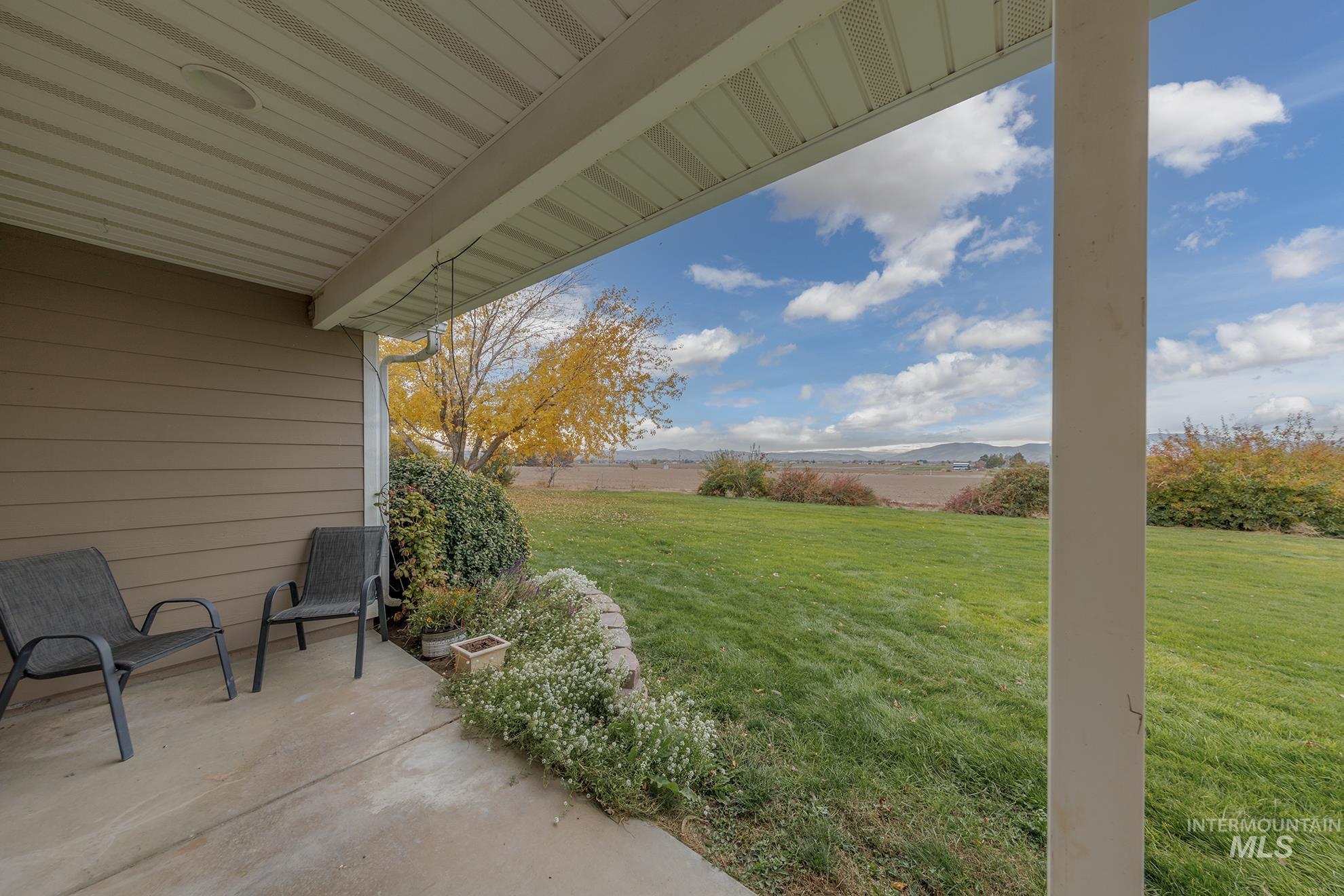890 Jenkins Creek Road Weiser, ID 83672 - Photo 26 of 45 View of yard with a patio and a mountain view