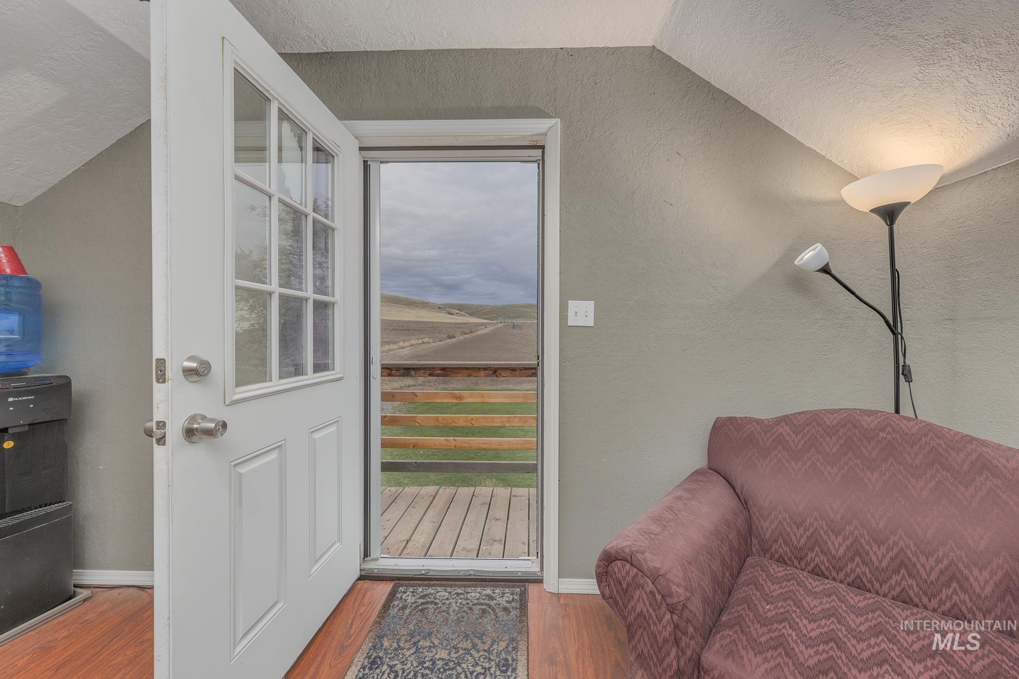 890 Jenkins Creek Road Weiser, ID 83672 - Photo 35 of 45 Entryway with wood finished floors, plenty of natural light, a textured ceiling, a textured wall, and lofted ceiling