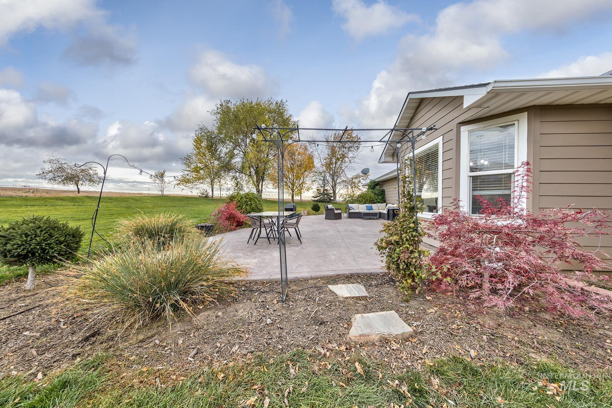 890 Jenkins Creek Road Weiser, ID 83672 - Photo 38 of 45 View of green lawn featuring a patio area