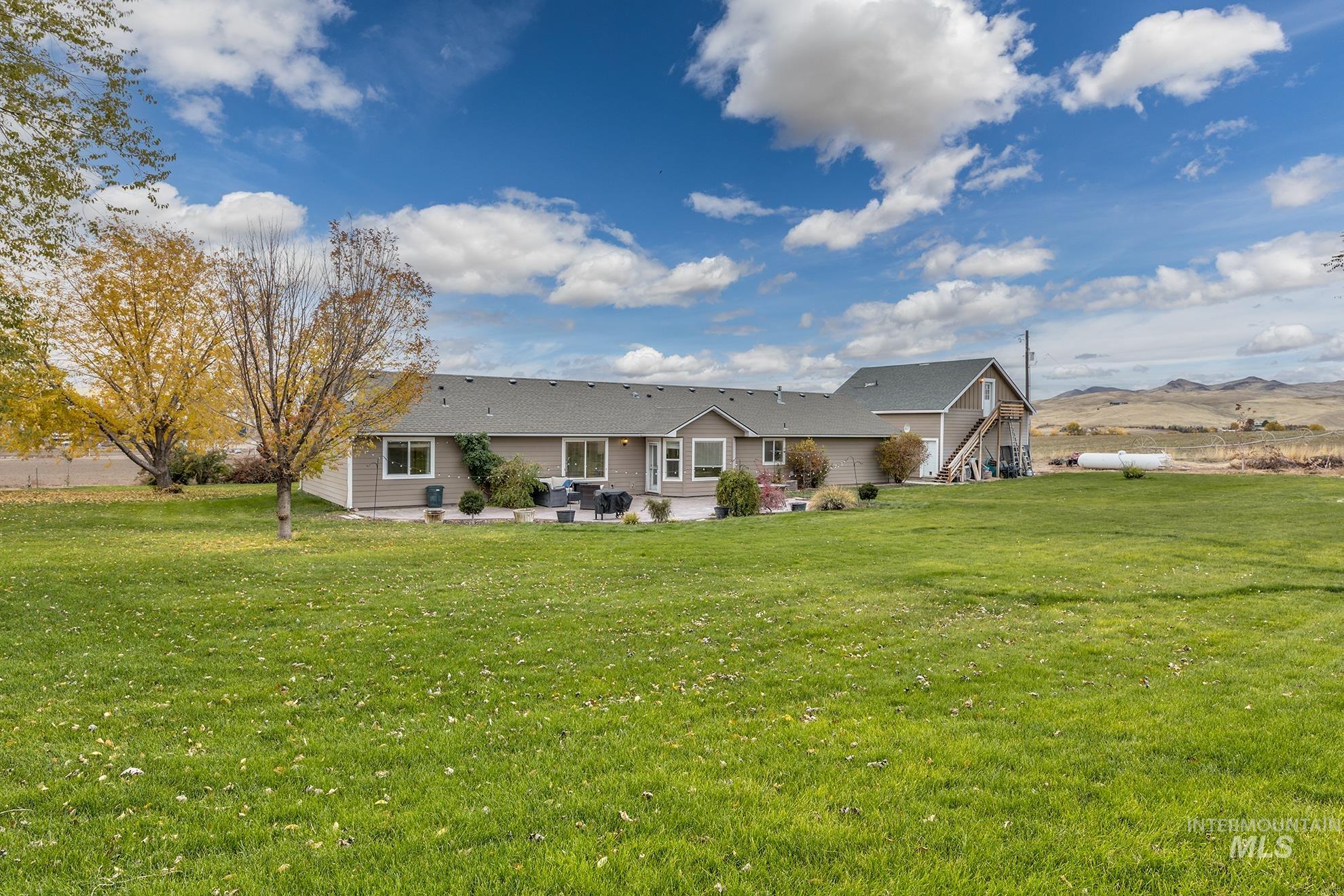 890 Jenkins Creek Road Weiser, ID 83672 - Photo 41 of 45 Back of house featuring a yard and a patio