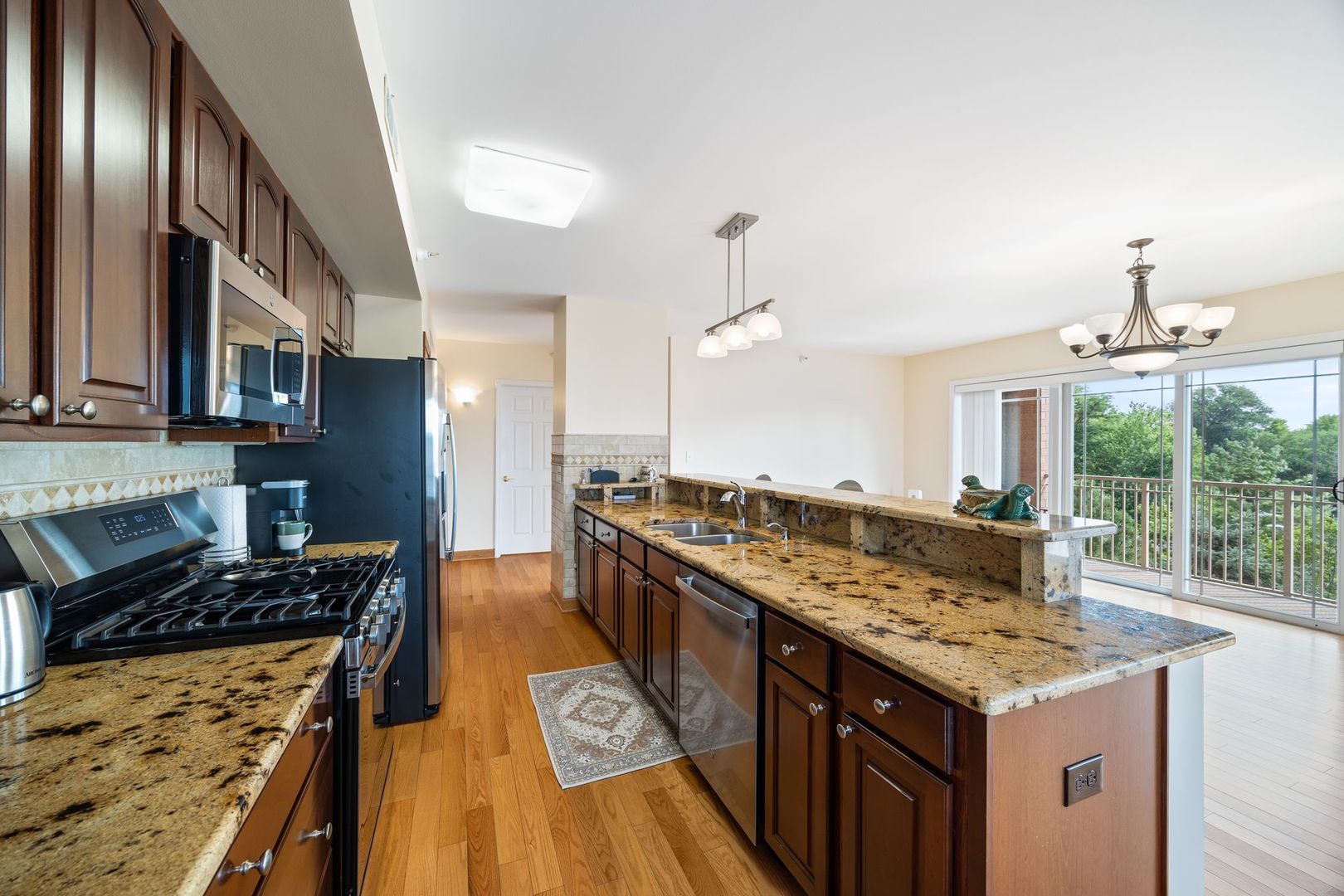 77 North Wolf Road, Unit 309 Northlake, IL 60164 - Photo 12 of 25 a kitchen with a stove and a sink