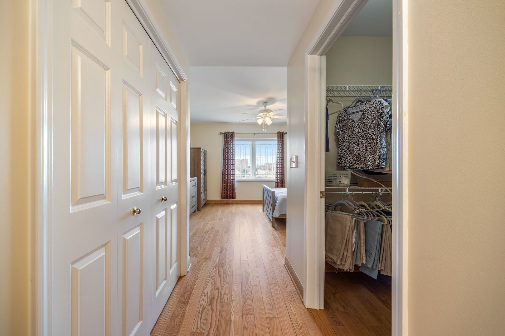 77 North Wolf Road, Unit 309 Northlake, IL 60164 - Photo 15 of 25 a view of a hallway with wooden floor and closet