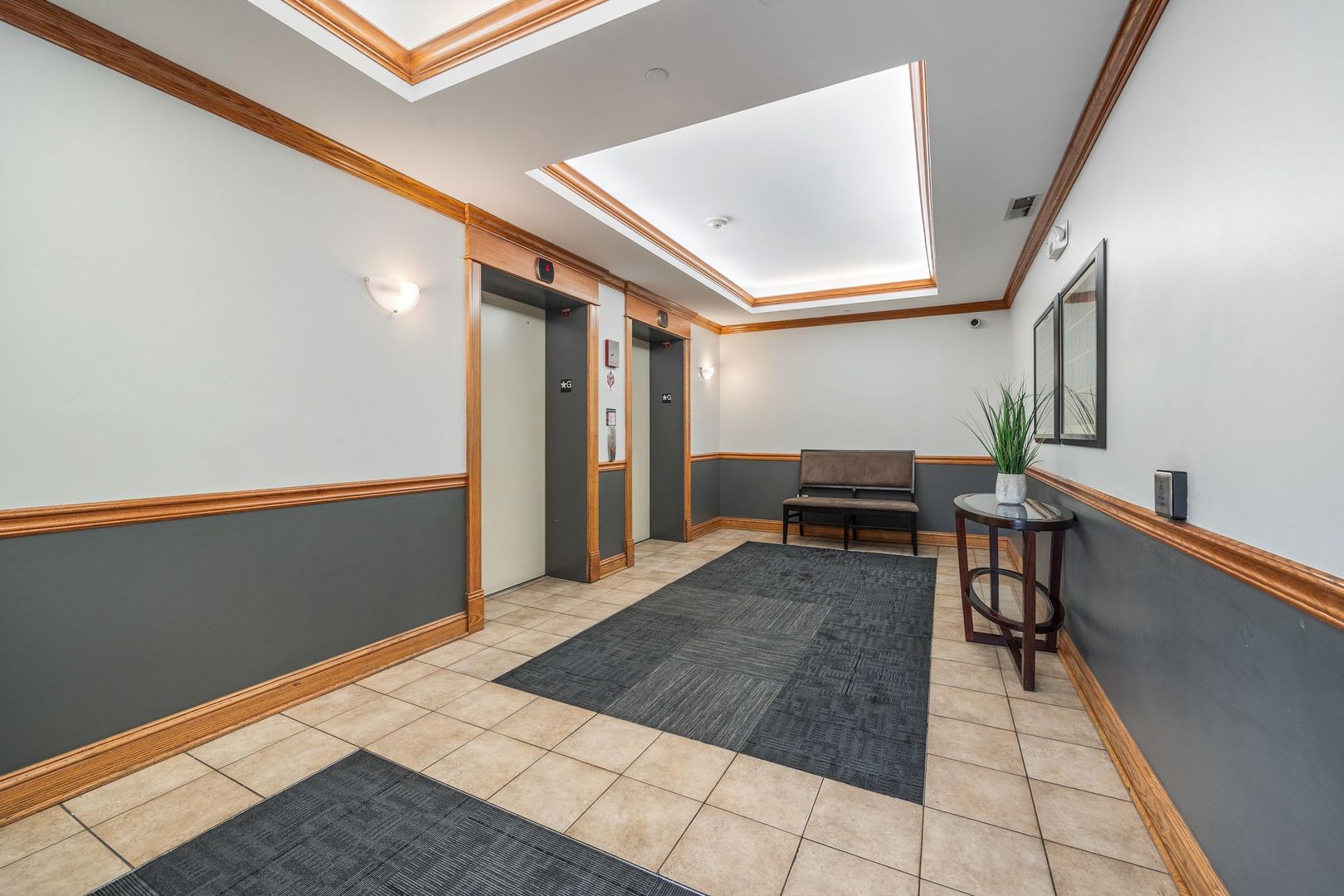 77 North Wolf Road, Unit 309 Northlake, IL 60164 - Photo 2 of 25 a room with furniture and stairs