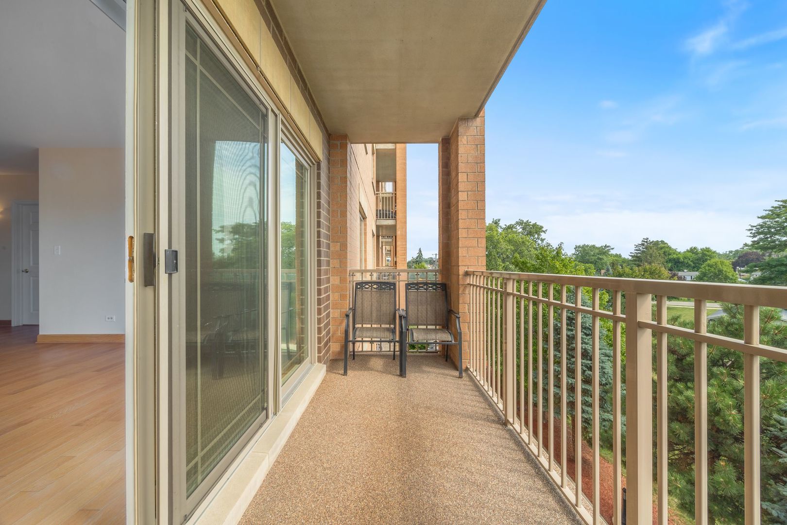 77 North Wolf Road, Unit 309 Northlake, IL 60164 - Photo 8 of 25 a view of a balcony with wooden floor