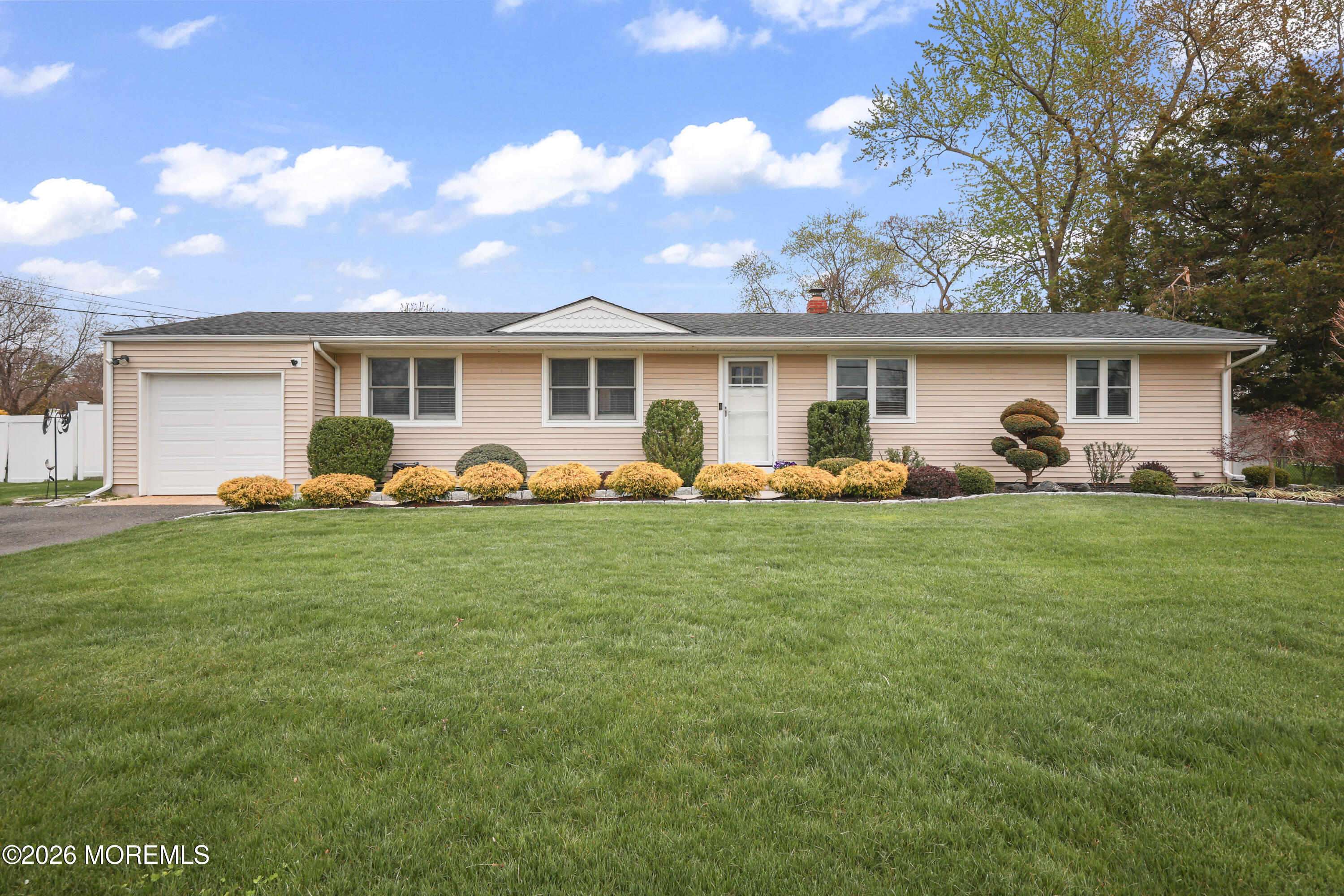 9 Maple Lane Howell, NJ 07731 - Photo 1 of 32 a front view of house with yard and outdoor seating