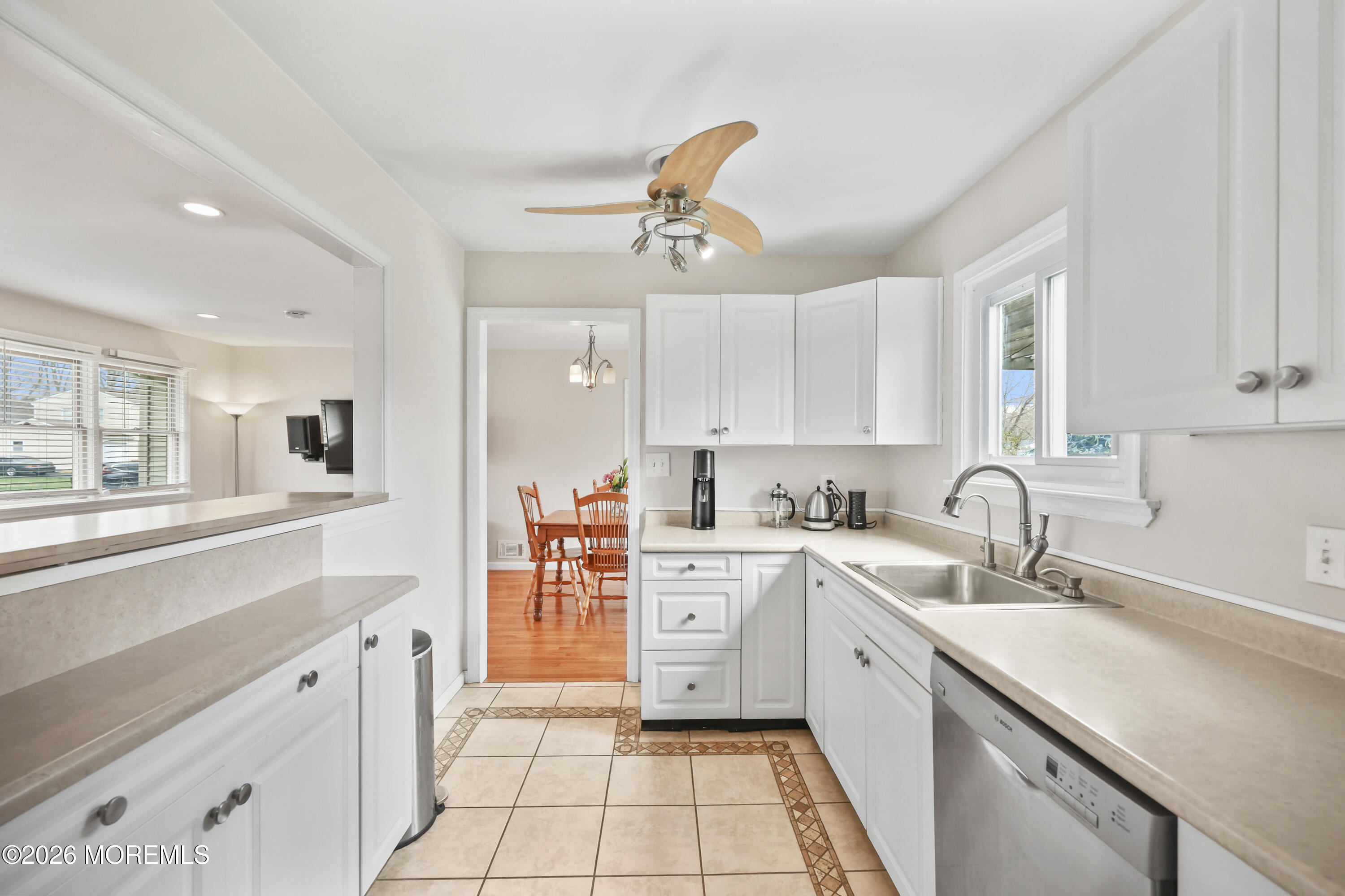 9 Maple Lane Howell, NJ 07731 - Photo 16 of 32 a kitchen with a sink window and cabinets