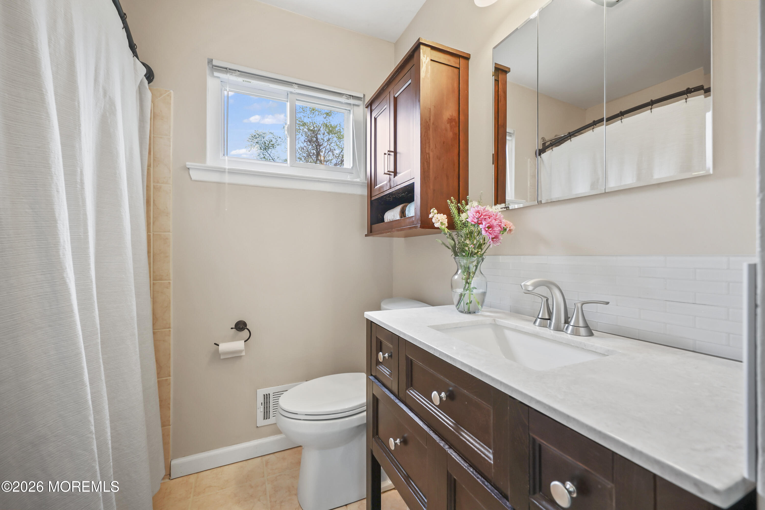 9 Maple Lane Howell, NJ 07731 - Photo 19 of 32 a bathroom with a sink a toilet and mirror