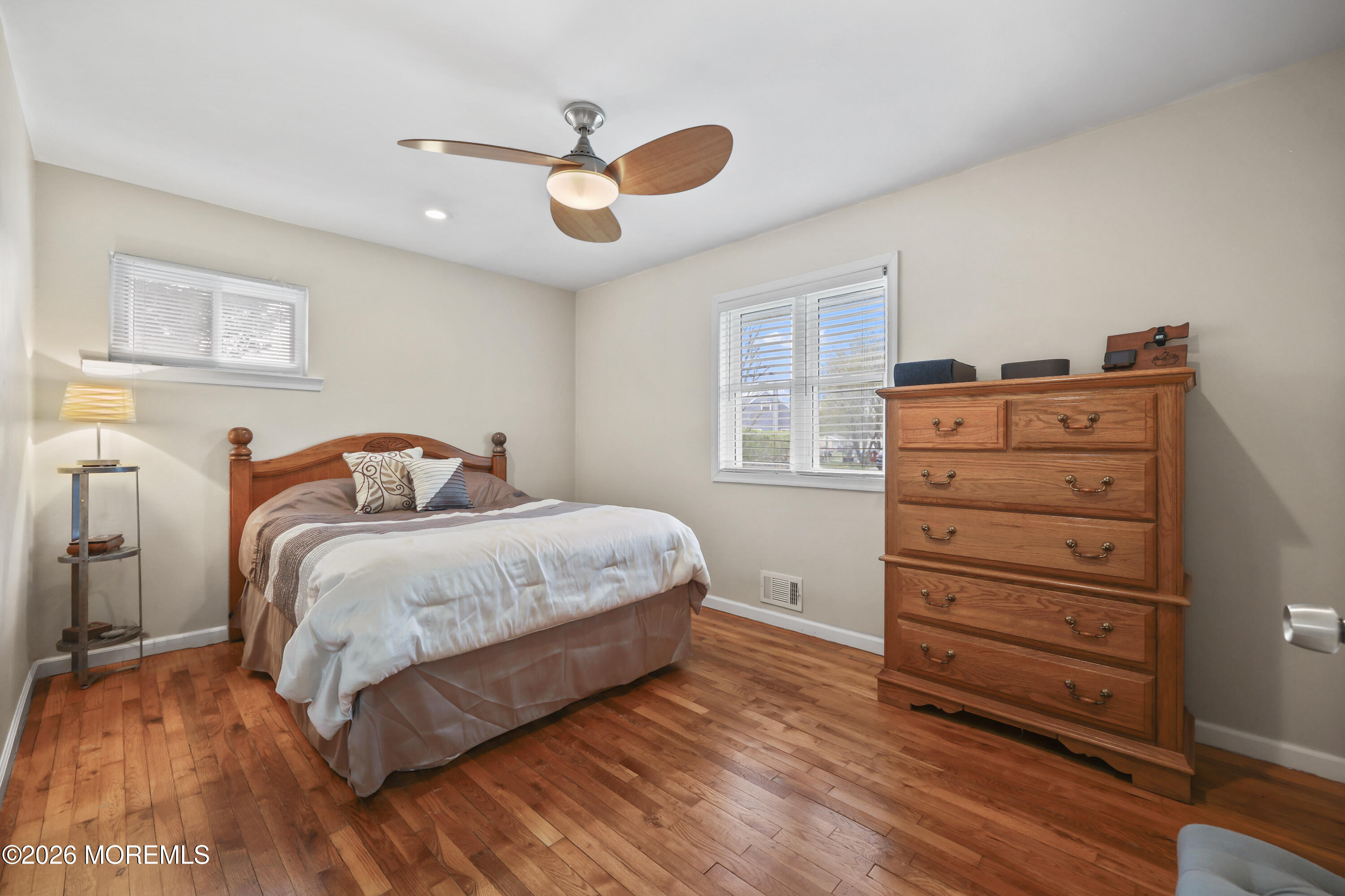 9 Maple Lane Howell, NJ 07731 - Photo 20 of 32 a bedroom with a bed and wooden floor