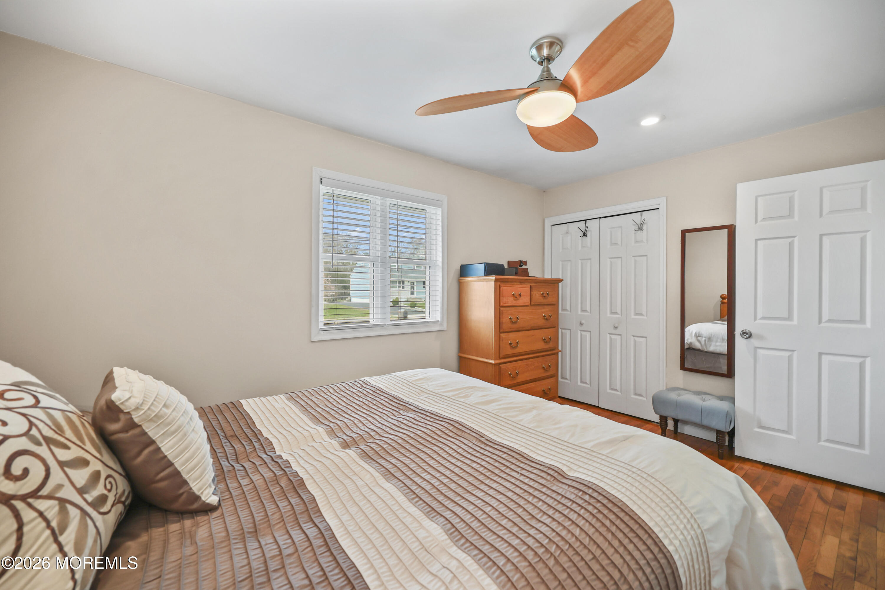 9 Maple Lane Howell, NJ 07731 - Photo 21 of 32 a bedroom with a bed and a chandelier