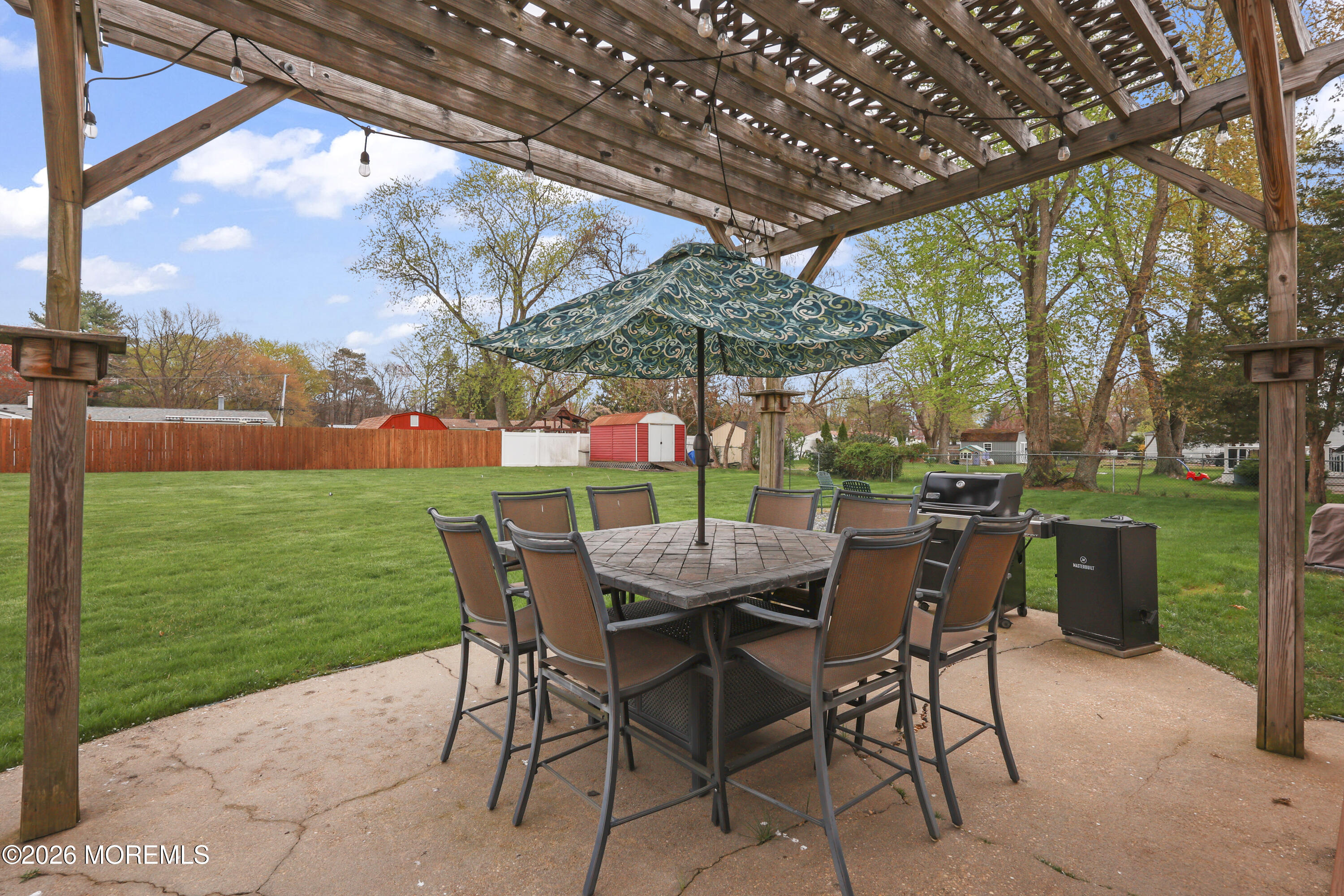 9 Maple Lane Howell, NJ 07731 - Photo 26 of 32 a patio with a yard table and chairs