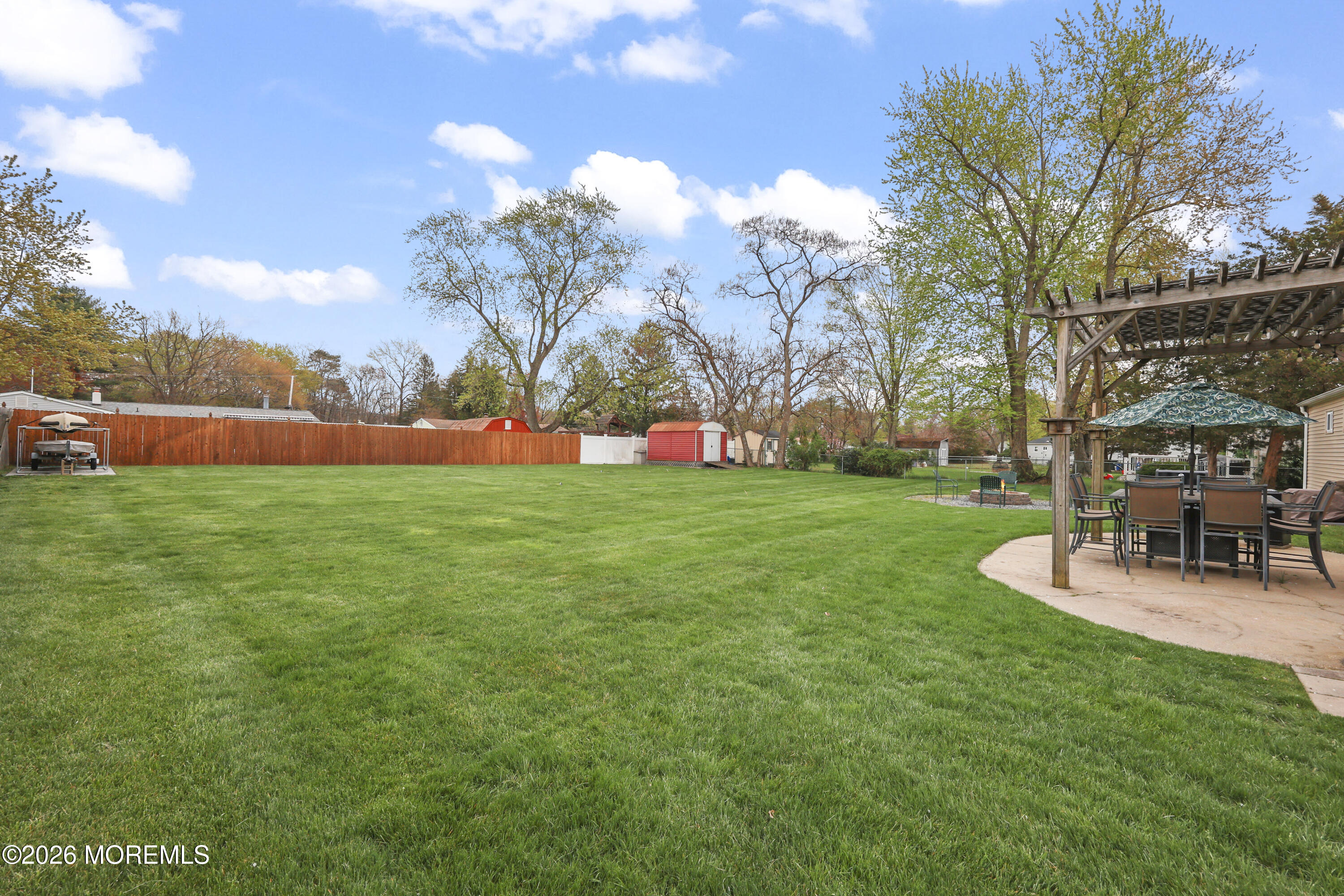 9 Maple Lane Howell, NJ 07731 - Photo 29 of 32 a view of a backyard with sitting area