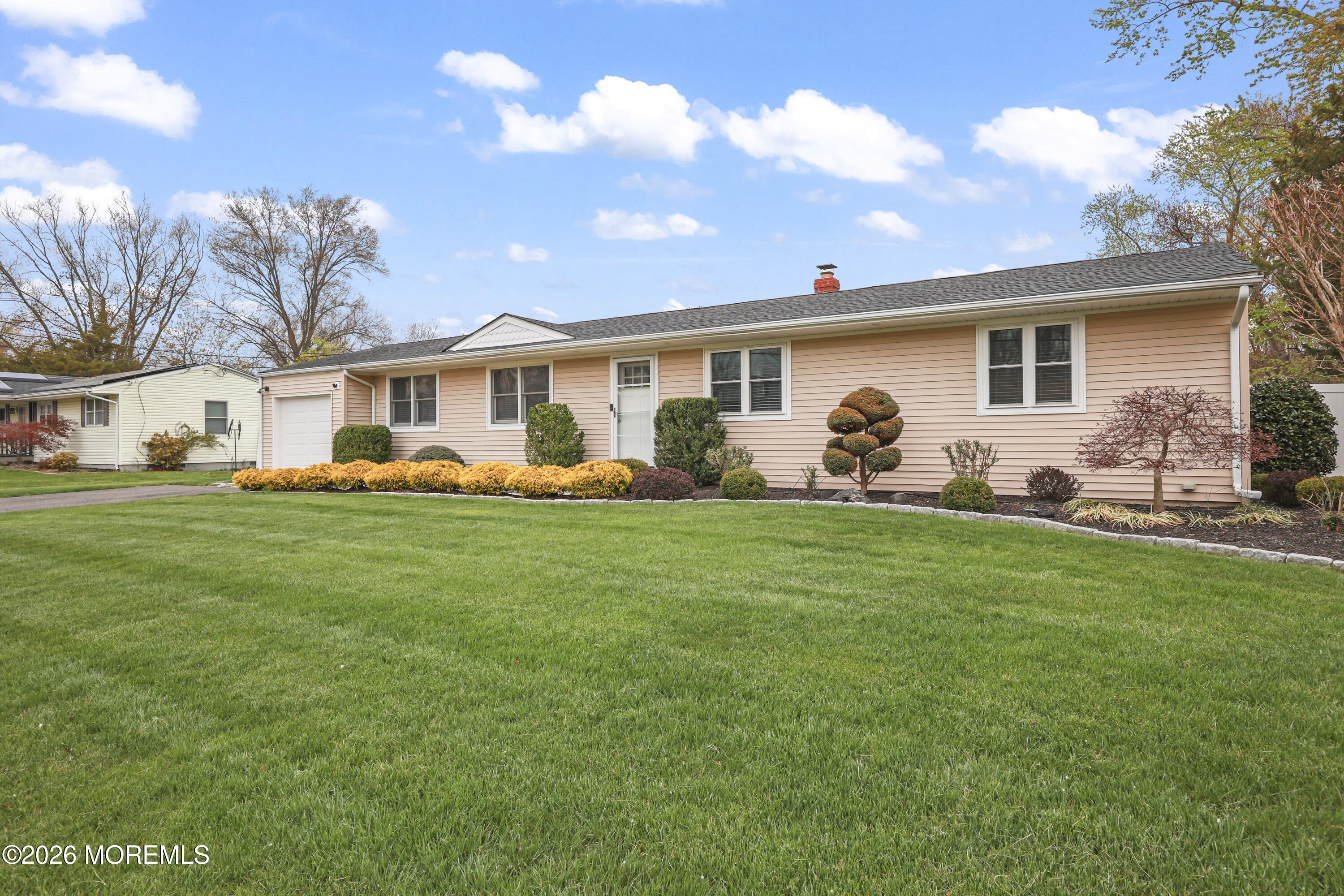 9 Maple Lane Howell, NJ 07731 - Photo 31 of 32 a front view of house with yard and outdoor seating