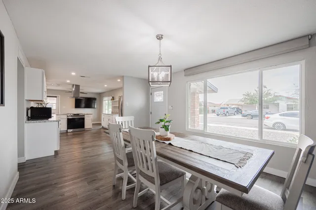 wooden floor and white cabinets in a room