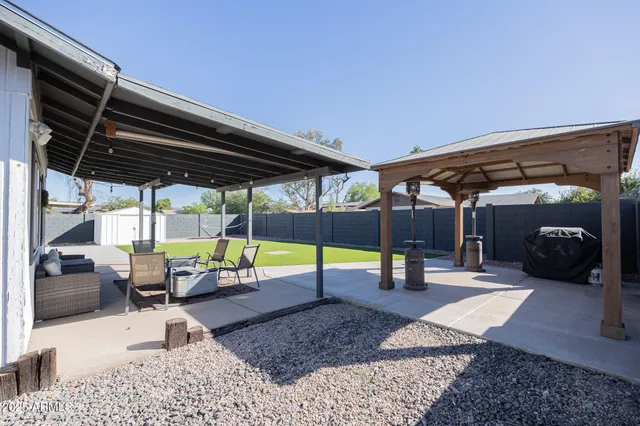 a view of a swimming pool with a patio