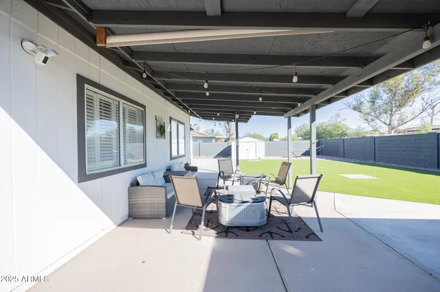 a work room with furniture and a window