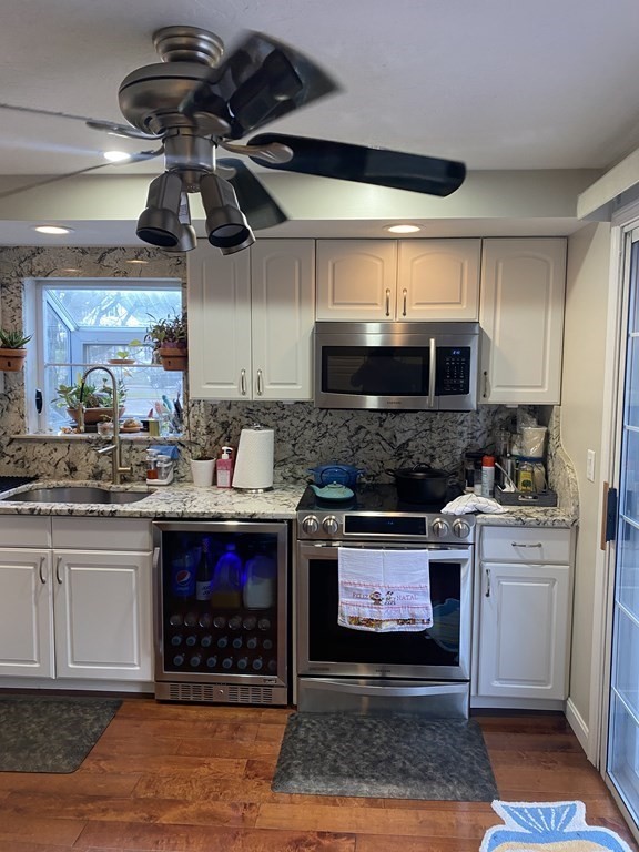 1 Jonathan Circle Worcester, MA 01604 - Photo 15 of 31 a kitchen with stainless steel appliances granite countertop a stove a sink and a microwave