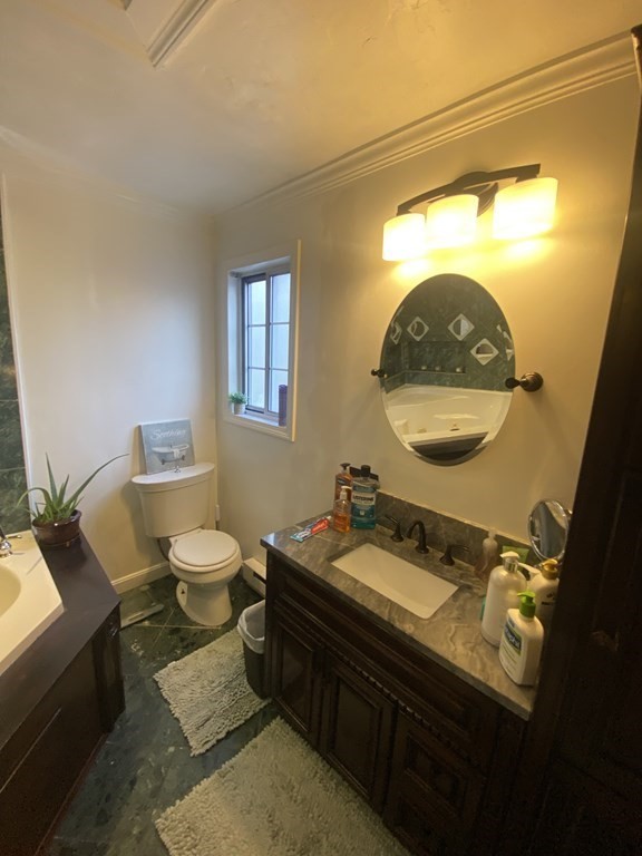 1 Jonathan Circle Worcester, MA 01604 - Photo 23 of 31 a bathroom with a sink and a mirror