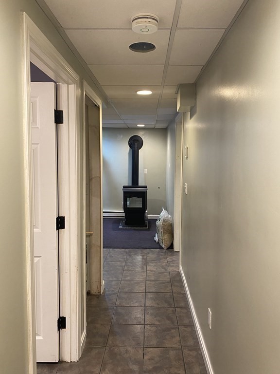 1 Jonathan Circle Worcester, MA 01604 - Photo 27 of 31 a view of a hallway with a livingroom and a bathroom with sink