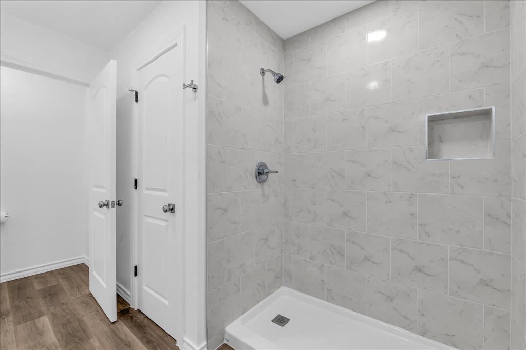 204 North Wiebusch Street Riesel, TX 76682 - Photo 17 of 33 a bathroom with a shower and a toilet