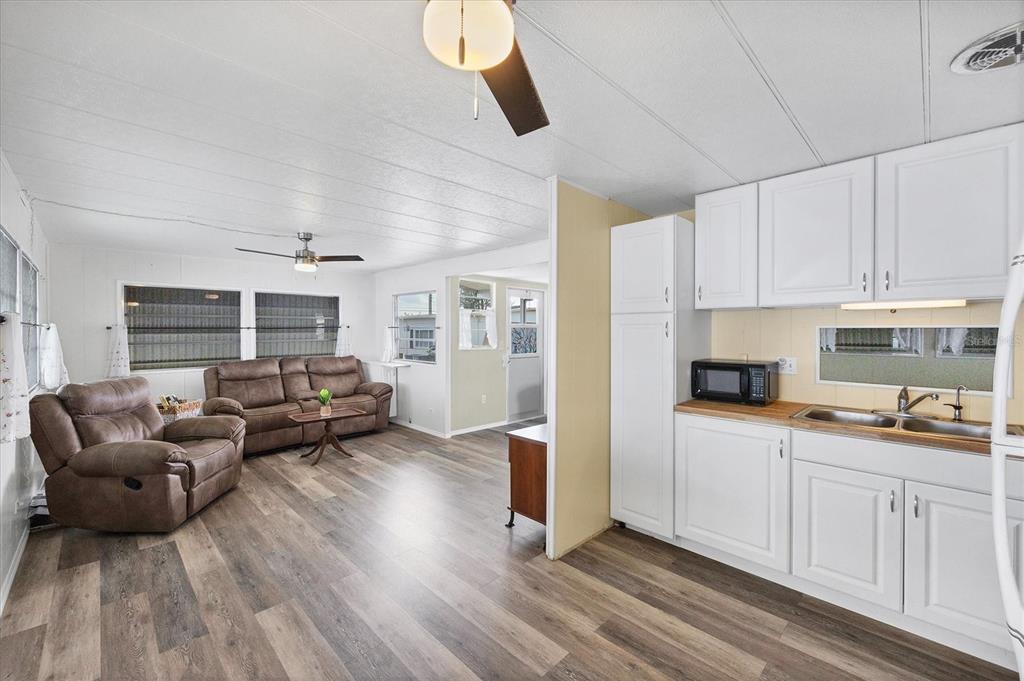 4114 10th St Court East Ellenton, FL 34222 - Photo 11 of 44 a living room with furniture and a wooden floor