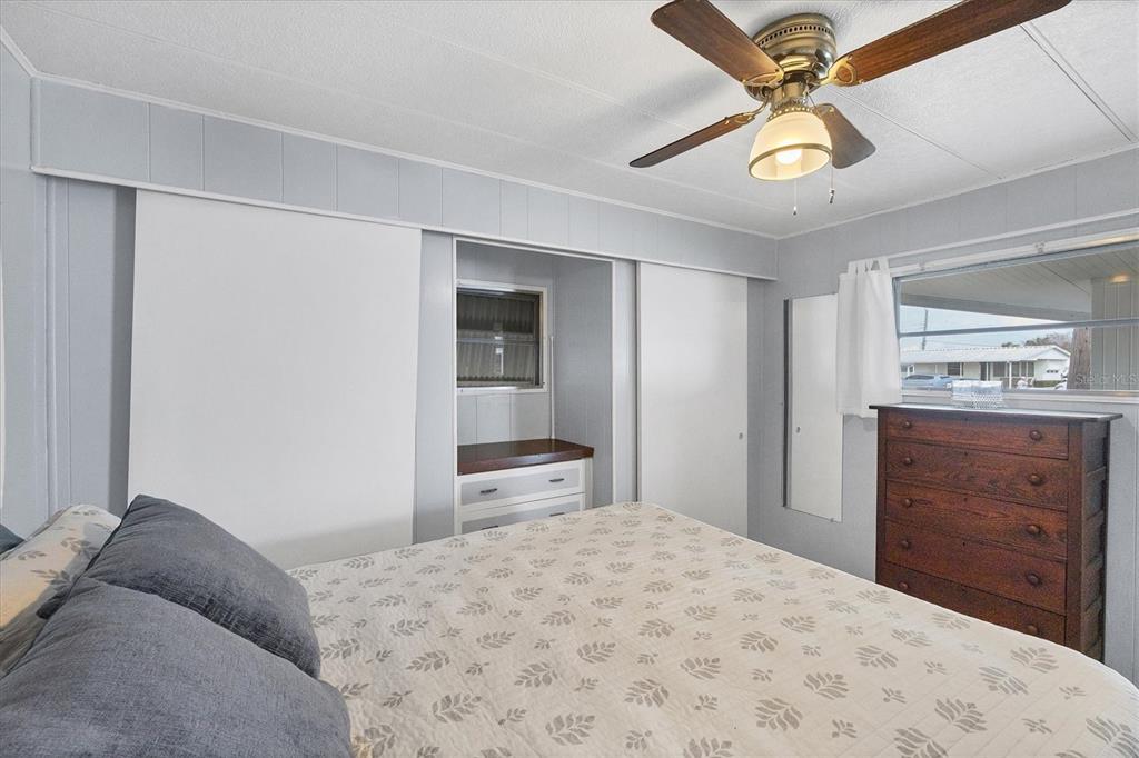 4114 10th St Court East Ellenton, FL 34222 - Photo 15 of 44 a bedroom with a bed and a dresser