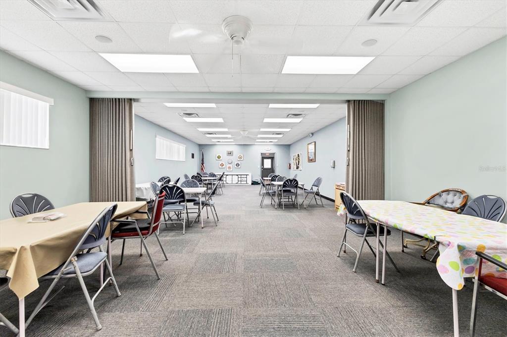 4114 10th St Court East Ellenton, FL 34222 - Photo 29 of 44 a view of a dining room with furniture and chandelier
