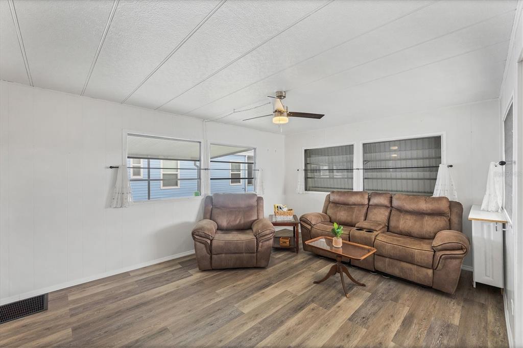 4114 10th St Court East Ellenton, FL 34222 - Photo 4 of 44 a living room with furniture and a couch