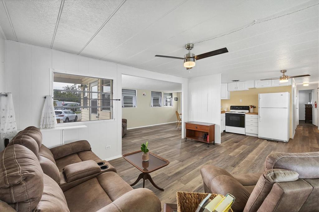 4114 10th St Court East Ellenton, FL 34222 - Photo 6 of 44 a living room with furniture and a fireplace