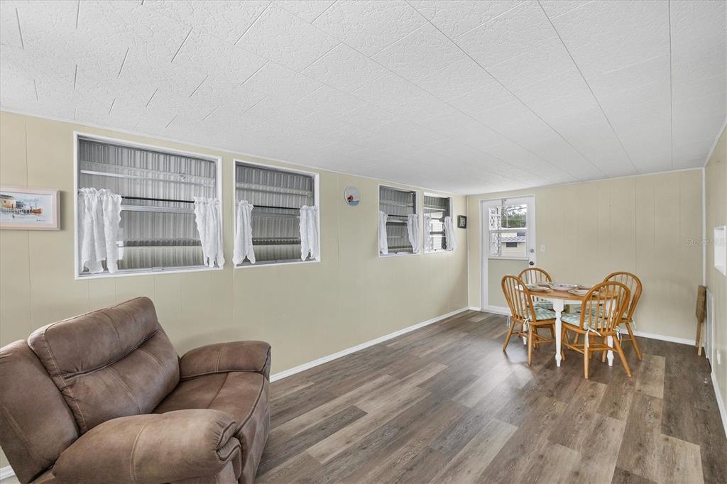4114 10th St Court East Ellenton, FL 34222 - Photo 7 of 44 a work room with furniture and wooden floor
