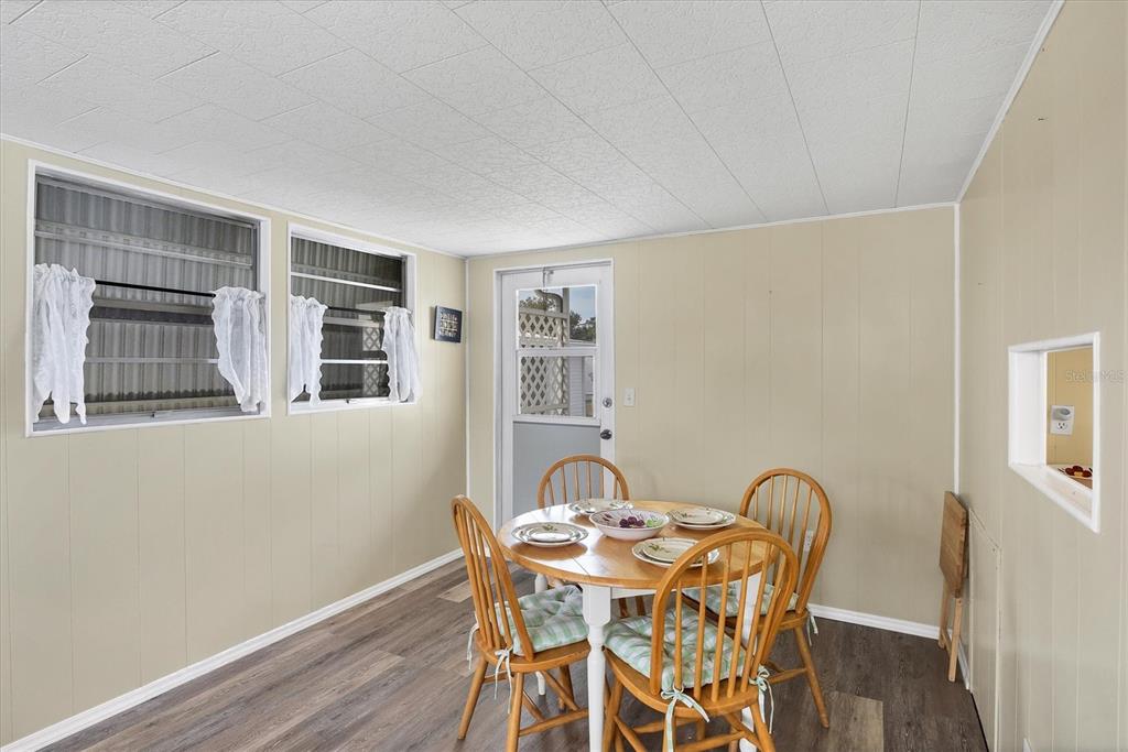 4114 10th St Court East Ellenton, FL 34222 - Photo 9 of 44 a view of a dining room with furniture and window
