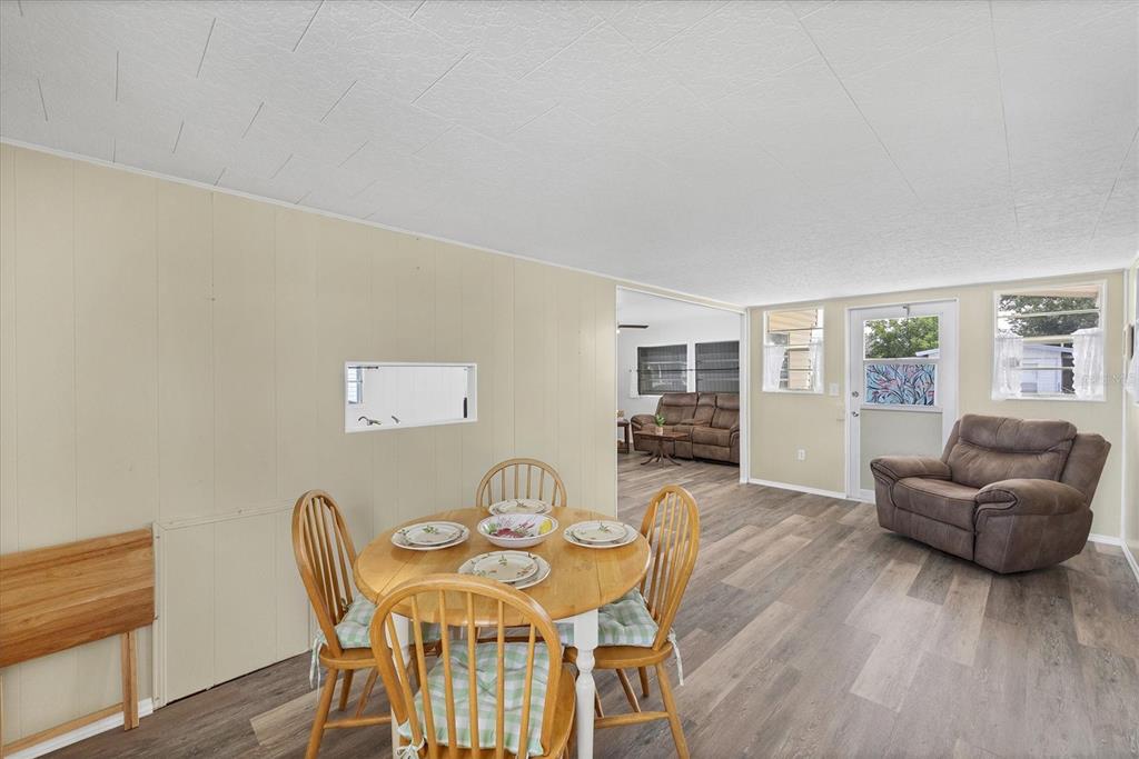 4114 10th St Court East Ellenton, FL 34222 - Photo 10 of 44 a living room with furniture and wooden floor