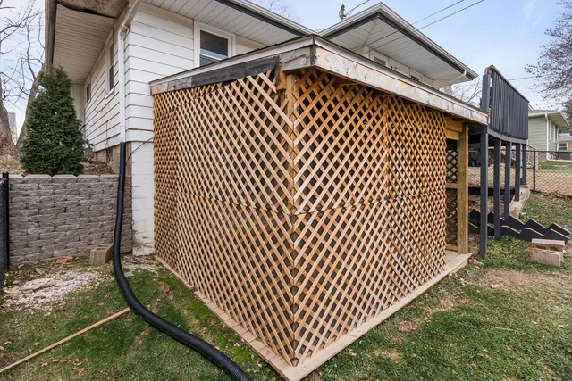 a view of a backyard with wooden fence