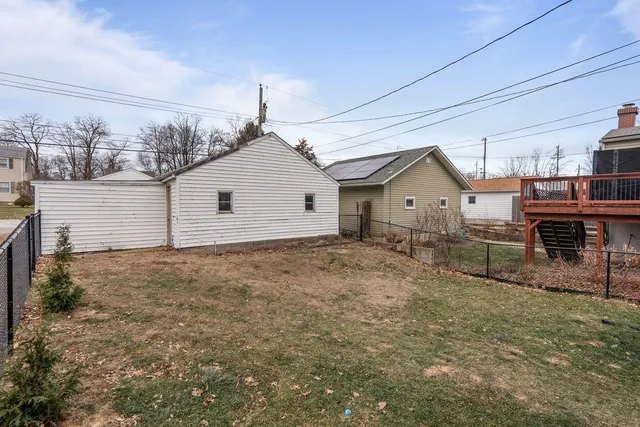 a view of a house with a backyard