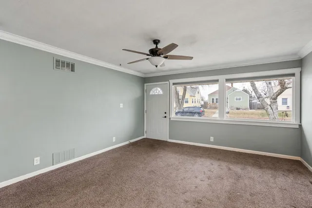 a view of an empty room with a window