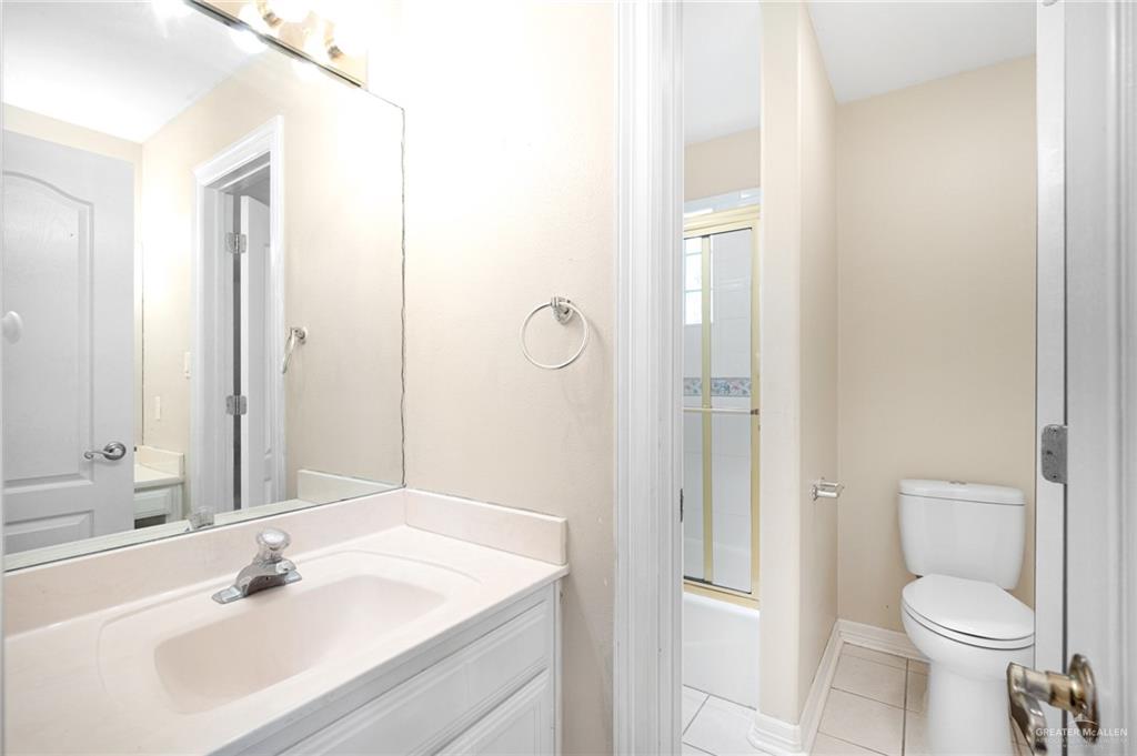 3814 B Shea Weslaco, TX 78596 - Photo 17 of 43 a bathroom with a sink a toilet and shower