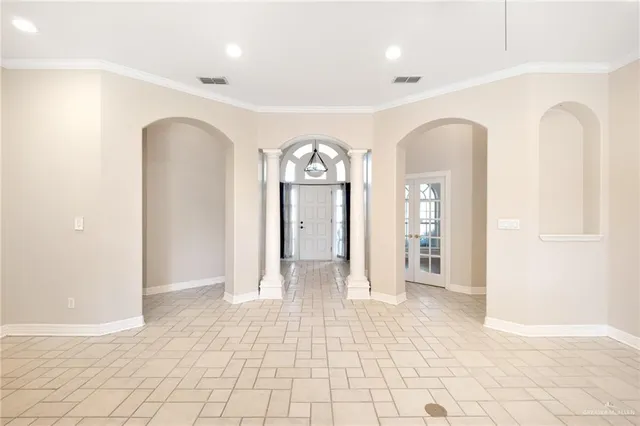 a view of an empty room with a fireplace