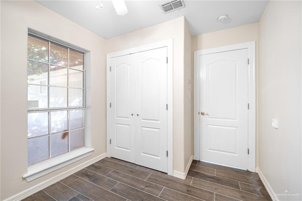 3814 B Shea Weslaco, TX 78596 - Photo 25 of 43 a view of an empty room with wooden floor and a window