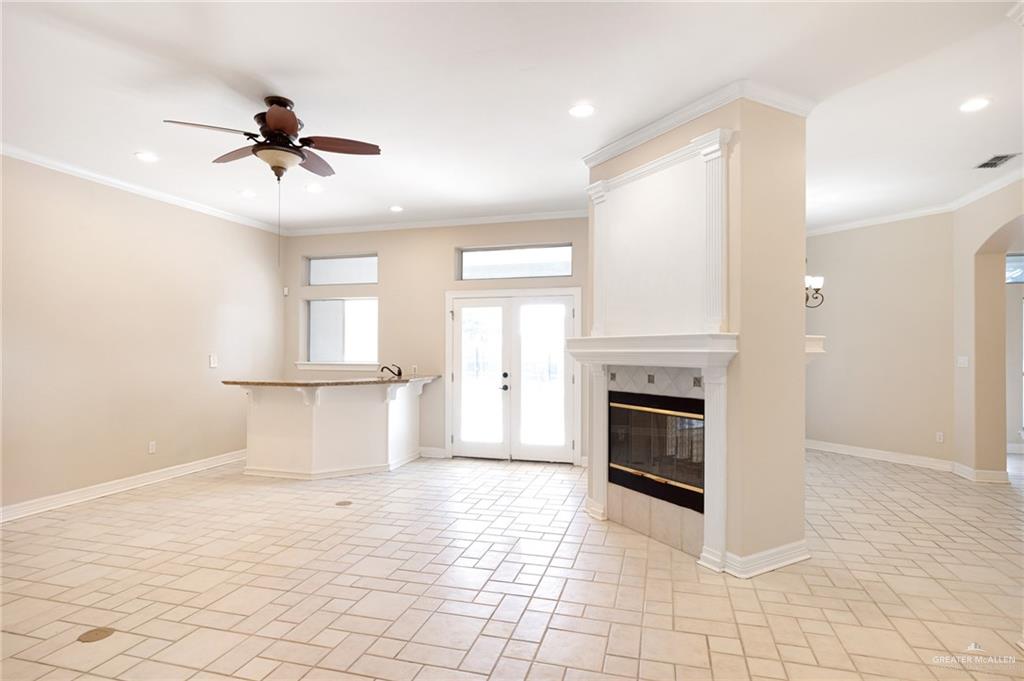 3814 B Shea Weslaco, TX 78596 - Photo 4 of 43 a view of a livingroom with a fireplace a ceiling fan and windows