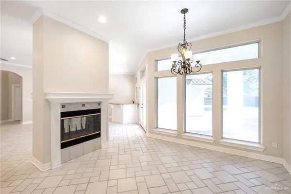 a view of a kitchen with furniture and an empty room