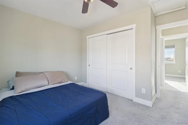 a room with a bed and a cabinet